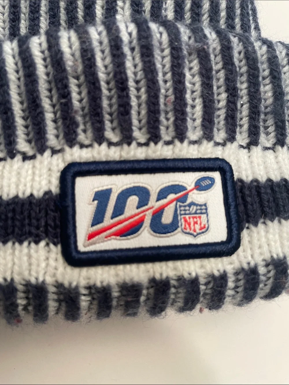New Era Navy and White Striped Pom Beanie for the Youth